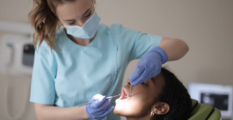 A dentist examining a patient.