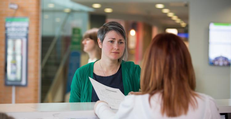 A person at a reception desk