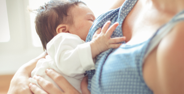 A mother breastfeeding her baby